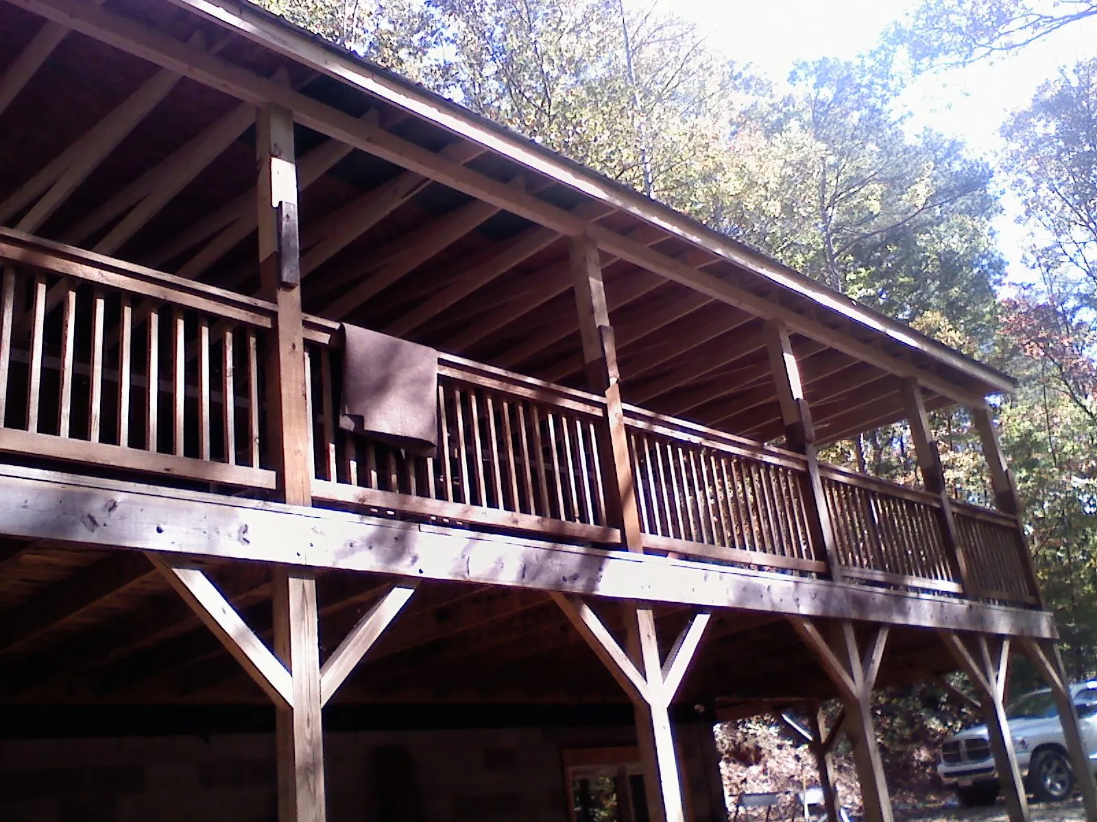Timber framing under a new elevated porch and deck — Roof Leak Repair in Dimondale by Roofing Brothers
